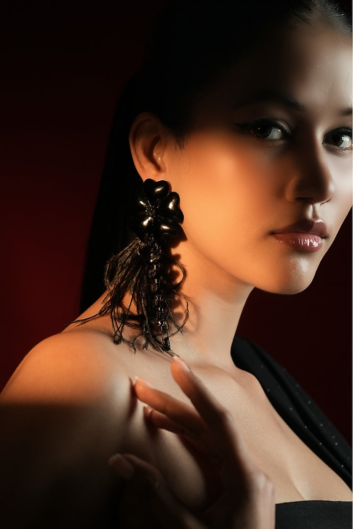 Gold Finish Crystal & Feather Tassel Enameled Floral Dangler Earrings by Bijoux By Priya Chandna at Pernia's Pop Up Shop
