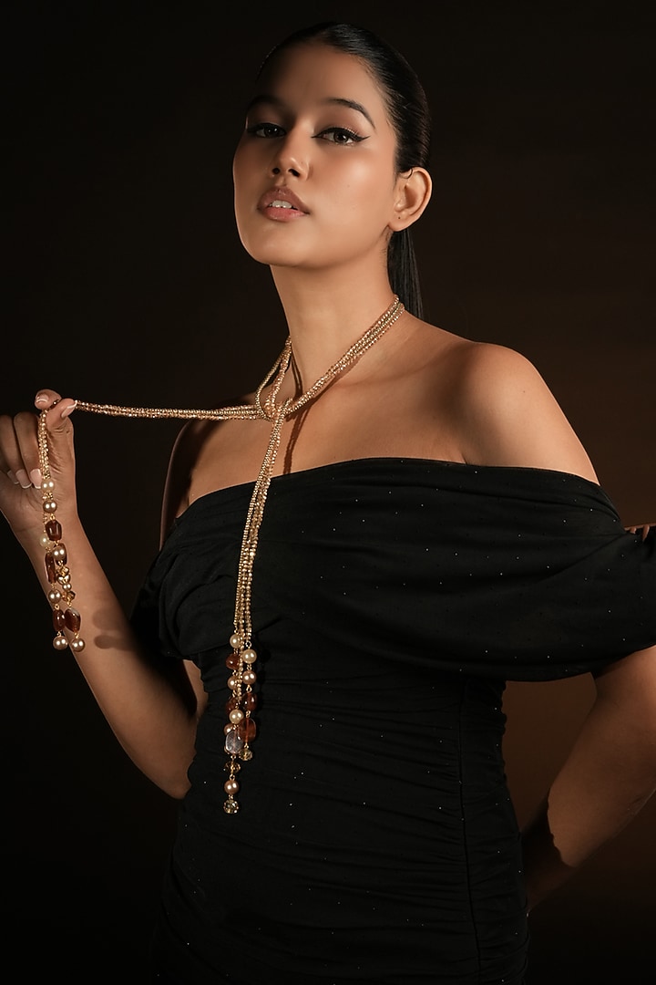 Gold Finish Pearl Drop & Coffee Brown Beaded Lariat Knot Necklace by Bijoux By Priya Chandna at Pernia's Pop Up Shop