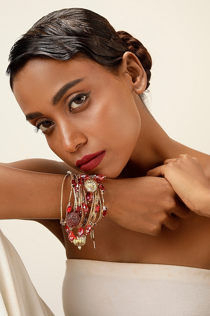 Gold Finish Red Crystal Layered Bracelet by Bijoux By Priya Chandna at Pernia's Pop Up Shop