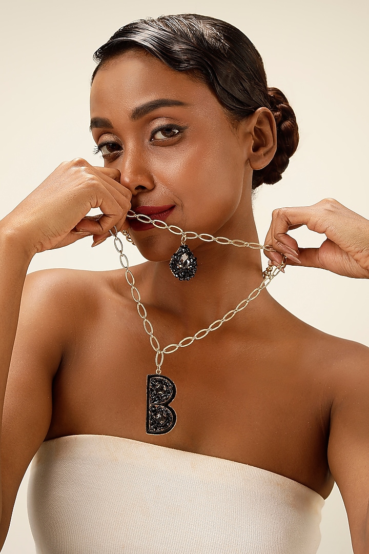 Gold Finish Black Crystal Initial Pendant Necklace by Bijoux By Priya Chandna at Pernia's Pop Up Shop