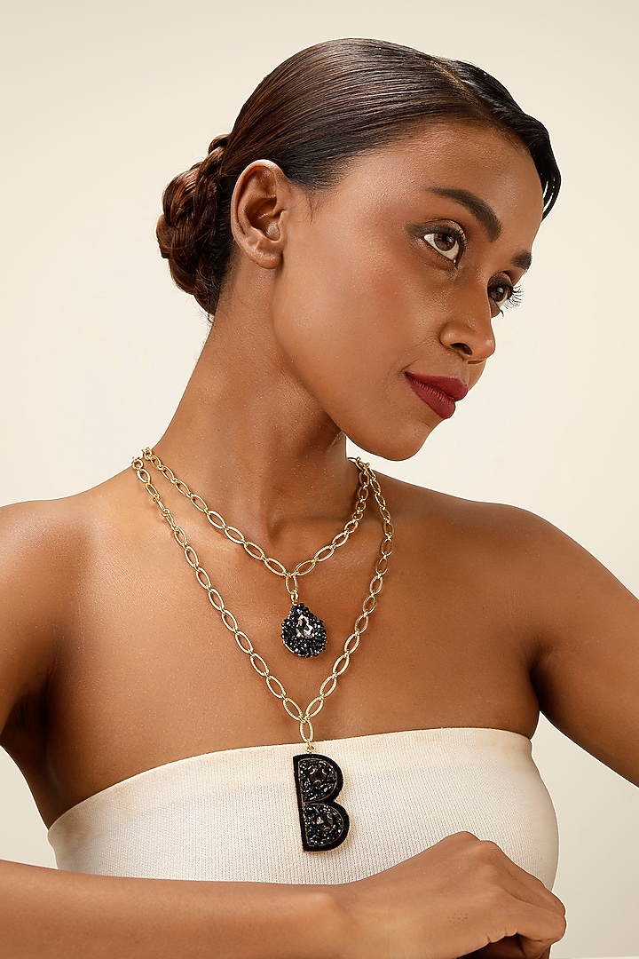 Gold Finish Black Crystal Initial Pendant Necklace by Bijoux By Priya Chandna at Pernia's Pop Up Shop