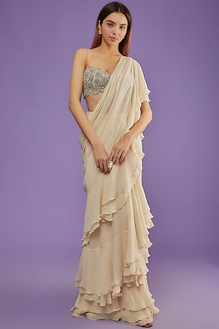 Nude Georgette Layered Ruffled Saree Set by Bhumika Sharma
