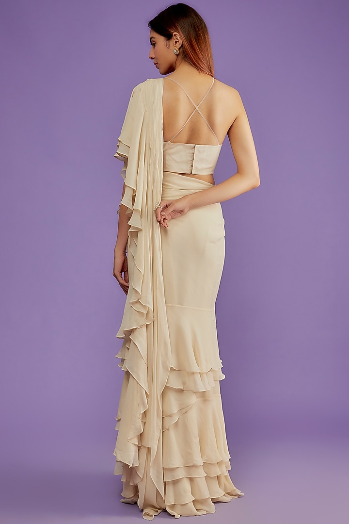 Nude Georgette Layered Ruffled Reception Saree Set by Bhumika Sharma at Pernia's Pop Up Shop