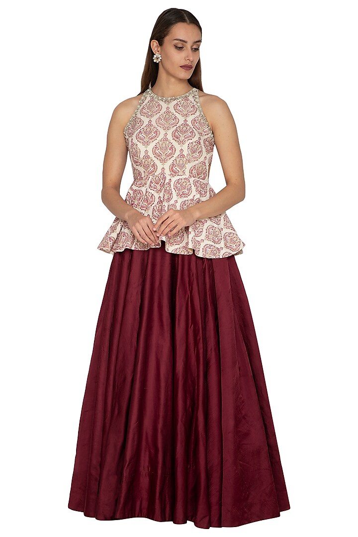 Ivory Embroidered Peplum Top With Maroon Skirt by Bhumika Sharma