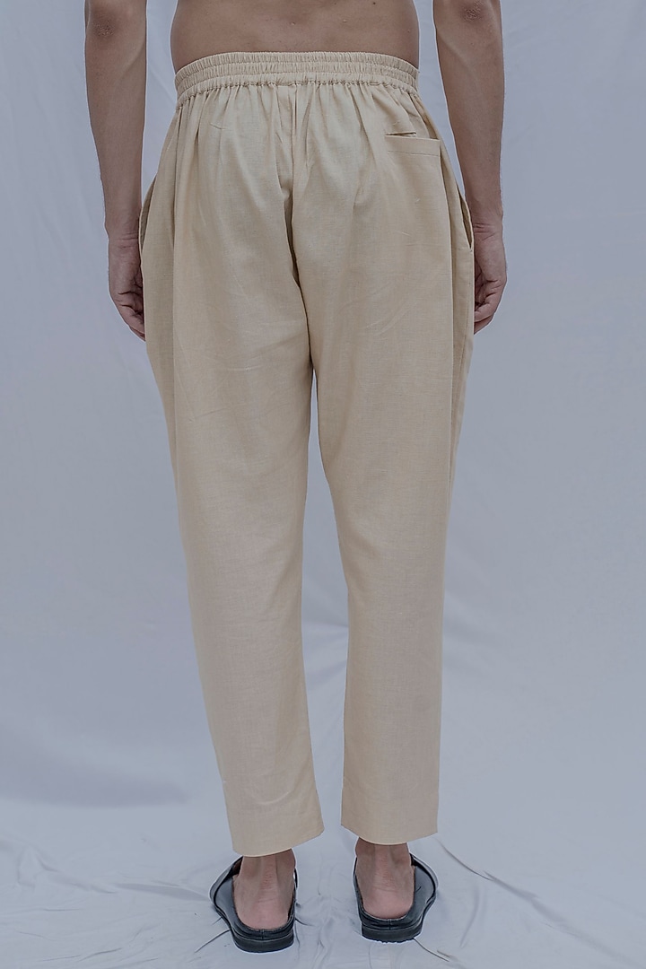 Cream Pleated Trousers by Bohame Men at Pernia's Pop Up Shop