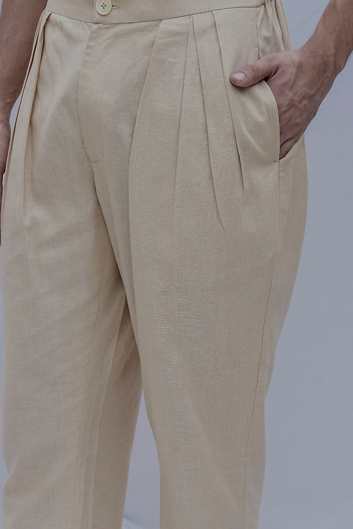 Cream Pleated Trousers by Bohame Men at Pernia's Pop Up Shop