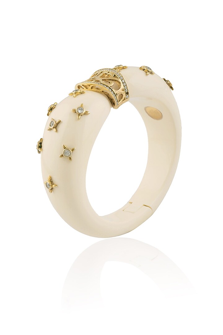 The Bohemian presents Gold plated ivory resin confetti bracelet and available only at Pernia's Pop Up Shop.
