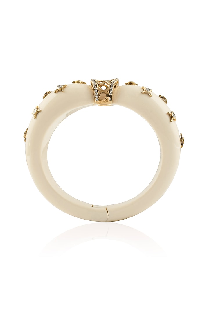 The Bohemian presents Gold plated ivory resin confetti bracelet and available only at Pernia's Pop Up Shop.