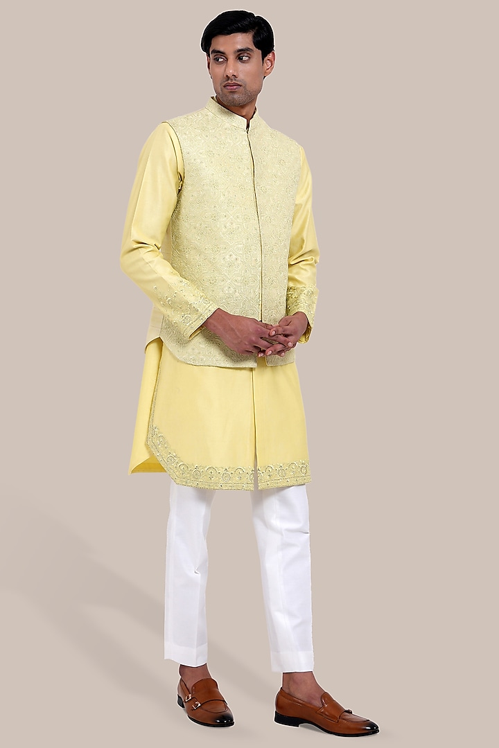 Yellow Raw Silk Embroidered Bundi Jacket Set by BRAHAAN