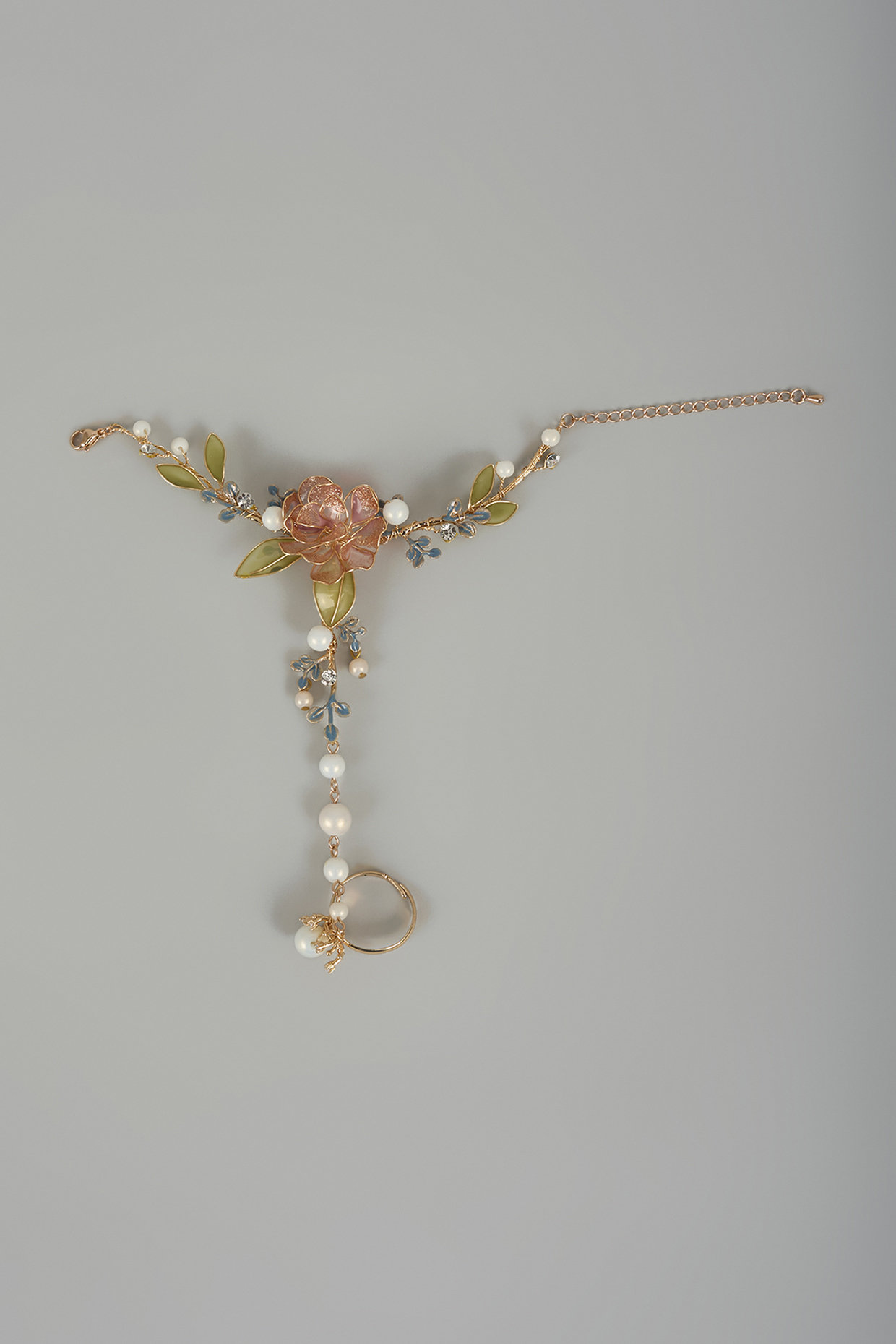 Gold Finish Pink Enameled Handcrafted Adjustable Floral Hand Harness by THE BEAUTIFUL SECRET at Pernia's Pop Up Shop