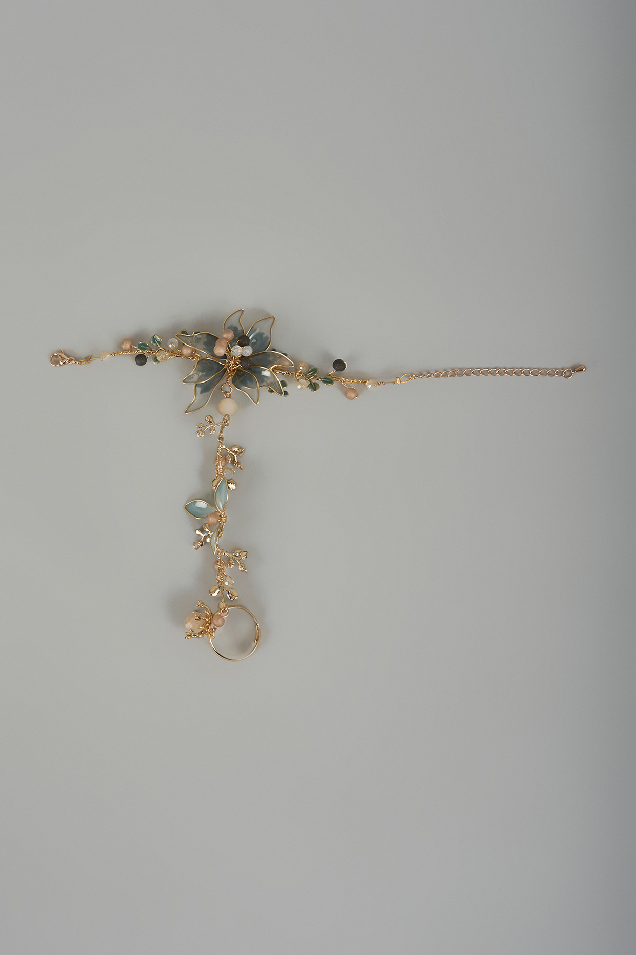 Gold Finish Blue Enameled Handcrafted Adjustable Floral Hand Harness by THE BEAUTIFUL SECRET at Pernia's Pop Up Shop