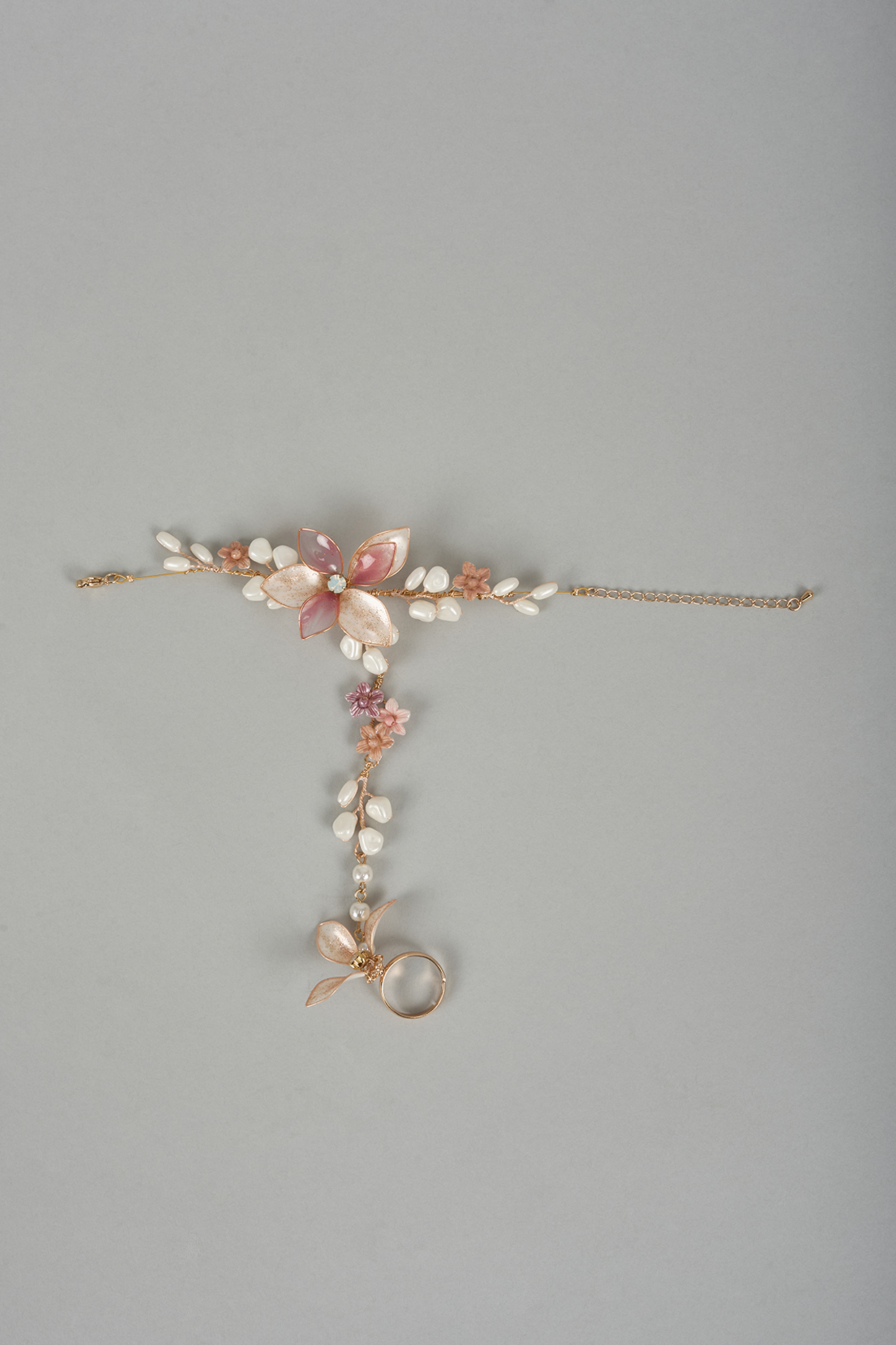 Gold Finish Pink Enameled Handcrafted Adjustable Floral Hand Harness by THE BEAUTIFUL SECRET at Pernia's Pop Up Shop