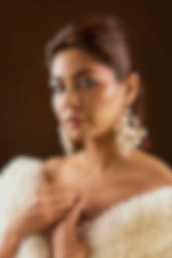 White Enameled Floral Dangler Earrings by THE BEAUTIFUL SECRET at Pernia's Pop Up Shop