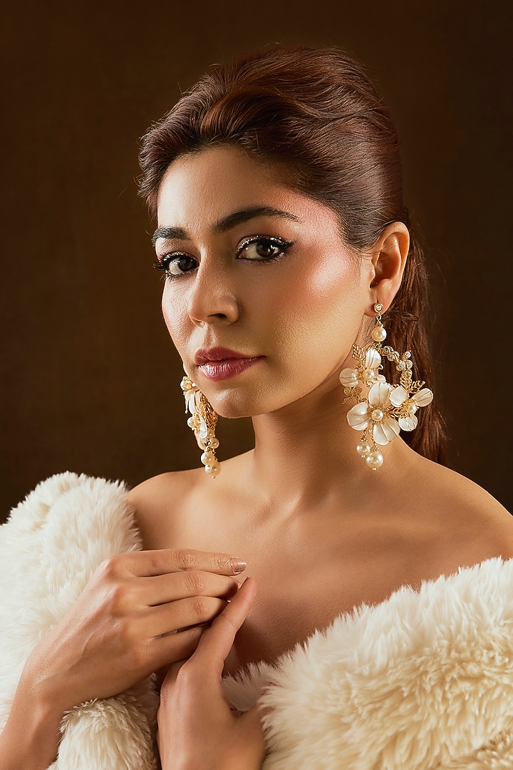 White Enameled Floral Dangler Earrings by THE BEAUTIFUL SECRET at Pernia's Pop Up Shop