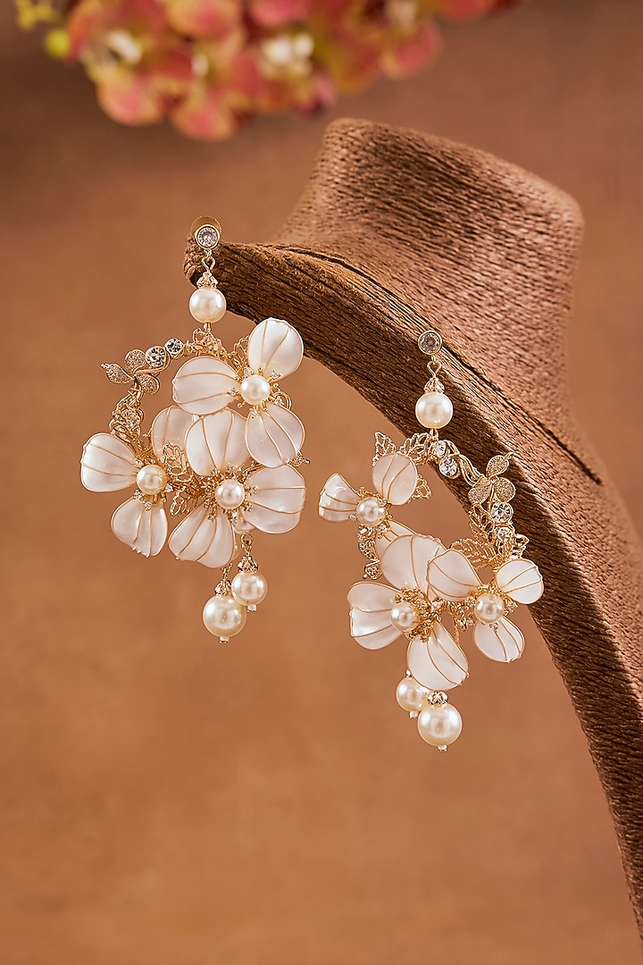 White Enameled Floral Dangler Earrings by THE BEAUTIFUL SECRET at Pernia's Pop Up Shop