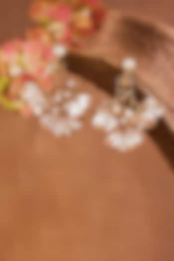 White Enameled Floral Dangler Earrings by THE BEAUTIFUL SECRET at Pernia's Pop Up Shop