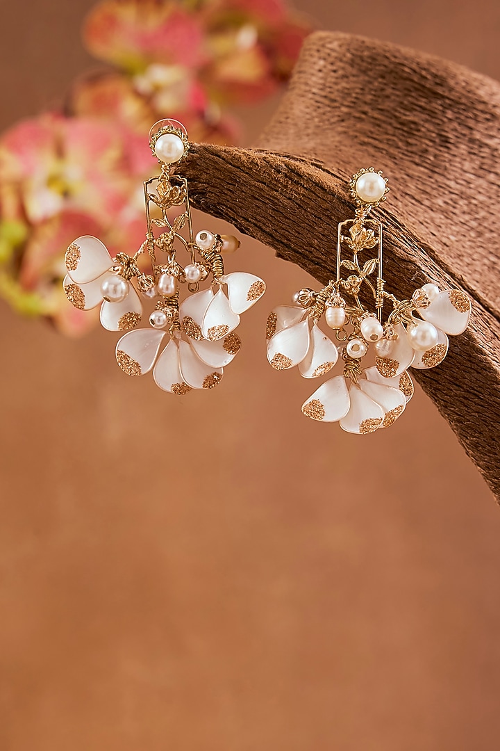 White Enameled Floral Dangler Earrings by THE BEAUTIFUL SECRET at Pernia's Pop Up Shop