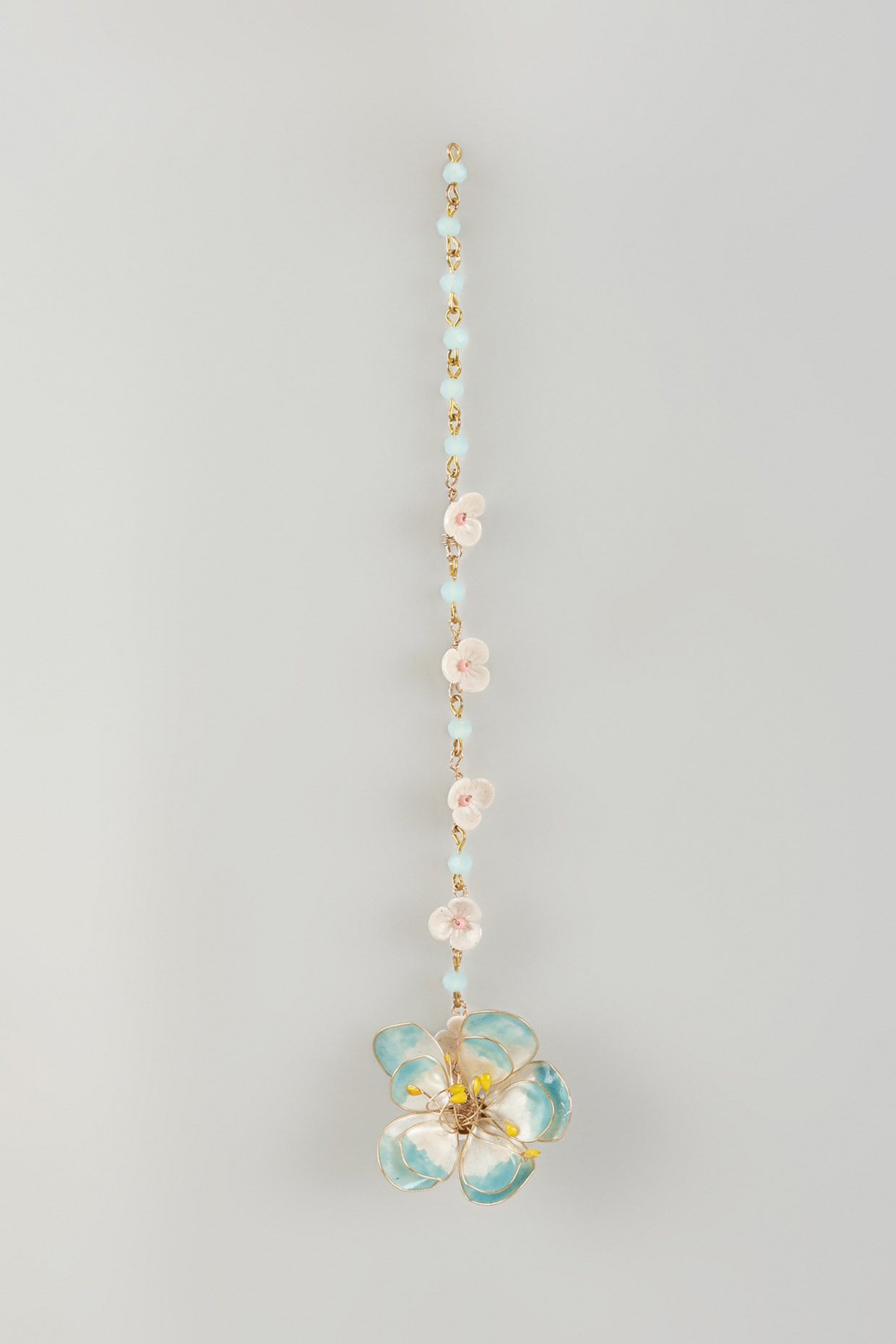 Gold Finish Blue Enameled Floral Maangtikka by THE BEAUTIFUL SECRET at Pernia's Pop Up Shop