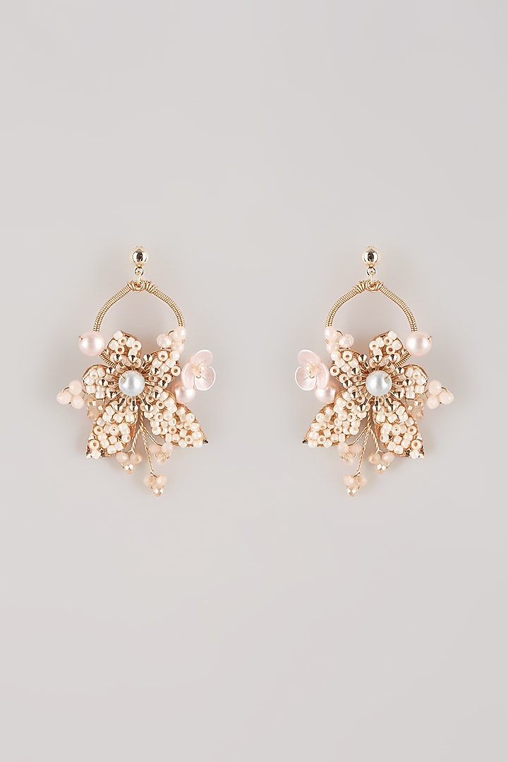 White Resin Floral Dangler Earrings by THE BEAUTIFUL SECRET at Pernia's Pop Up Shop