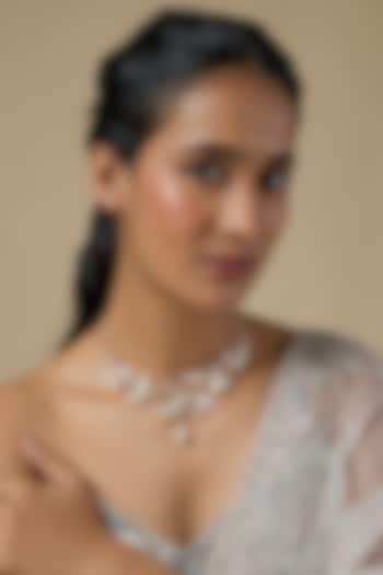 White Enameled Floral Necklace by THE BEAUTIFUL SECRET at Pernia's Pop Up Shop
