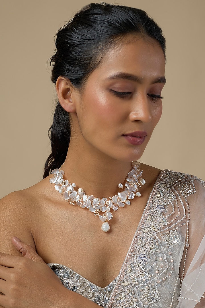 White Enameled Floral Necklace by THE BEAUTIFUL SECRET at Pernia's Pop Up Shop