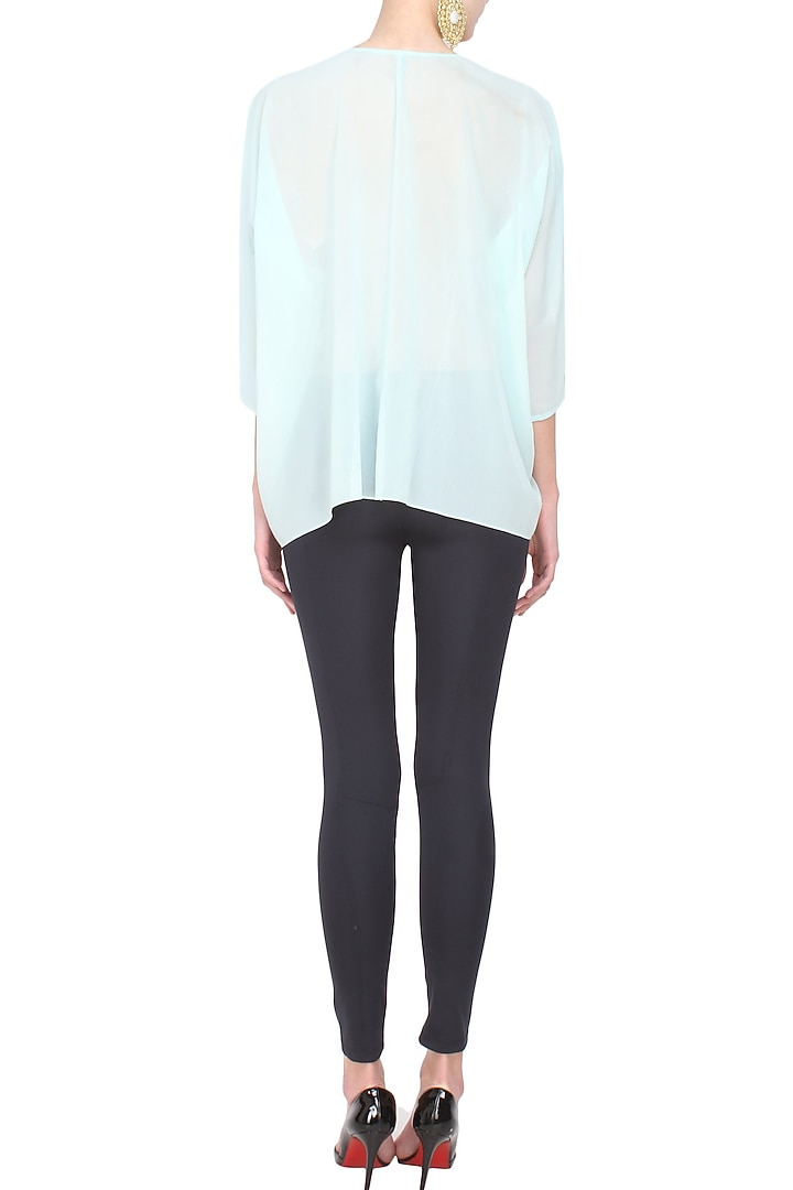 Light blue floral embroidered loose top available only at Pernia's Pop Up Shop.