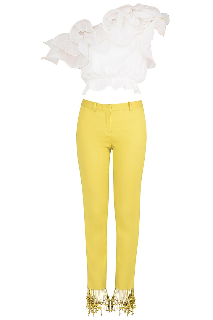 White ruffled crop top with iris yellow tasseled pants available only at Pernia's Pop Up Shop.