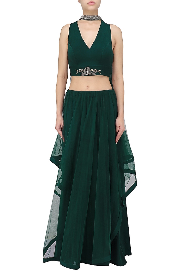 Midnight green asymmetrical lehenga set available only at Pernia's Pop Up Shop.