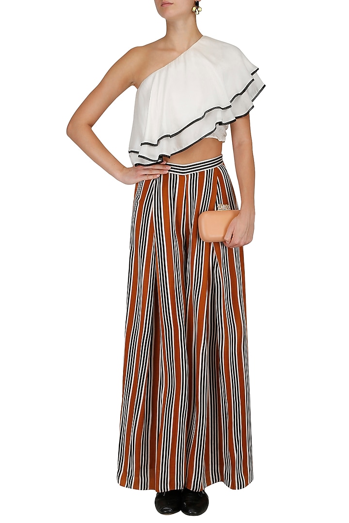 White one shoulder top and striped pants set available only at Pernia's Pop Up Shop.