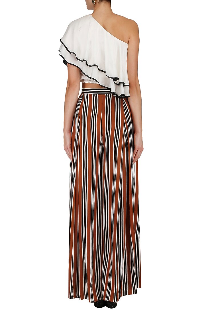 White one shoulder top and striped pants set available only at Pernia's Pop Up Shop.