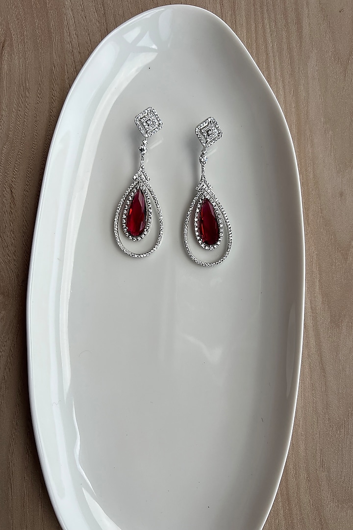 White Rhodium Finish Zirconia & Red Stone Dangler Earrings by Bubber Jewels at Pernia's Pop Up Shop