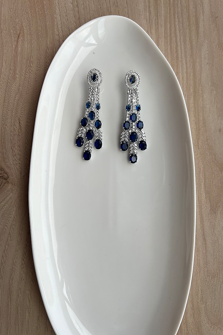 White Rhodium Finish Zirconia & Blue Stones Dangler Earrings by Bubber Jewels at Pernia's Pop Up Shop