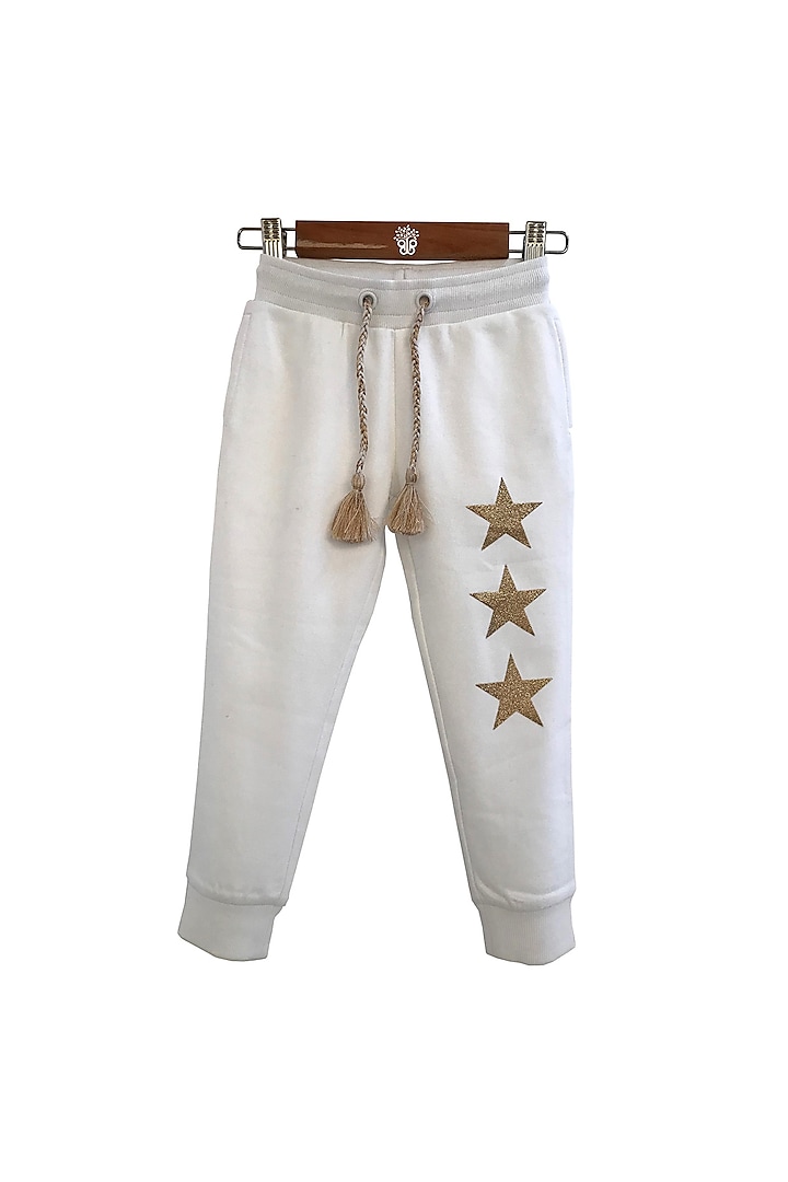 Ivory Printed Jogger Pants For Girls by BYB PREMIUM
