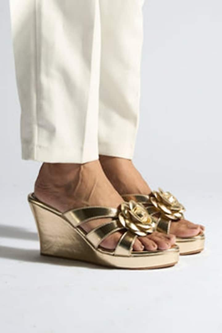 Gold PU Vegan Leather Floral Wedges by CAI at Pernia's Pop Up Shop