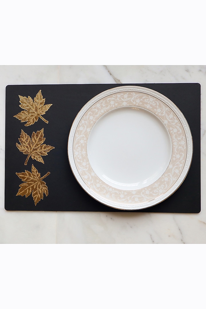 Black Faux Leather & Wooden Floral Printed Table Mats (Set of 6) by Chrysante By Gunjan Gupta at Pernia's Pop Up Shop