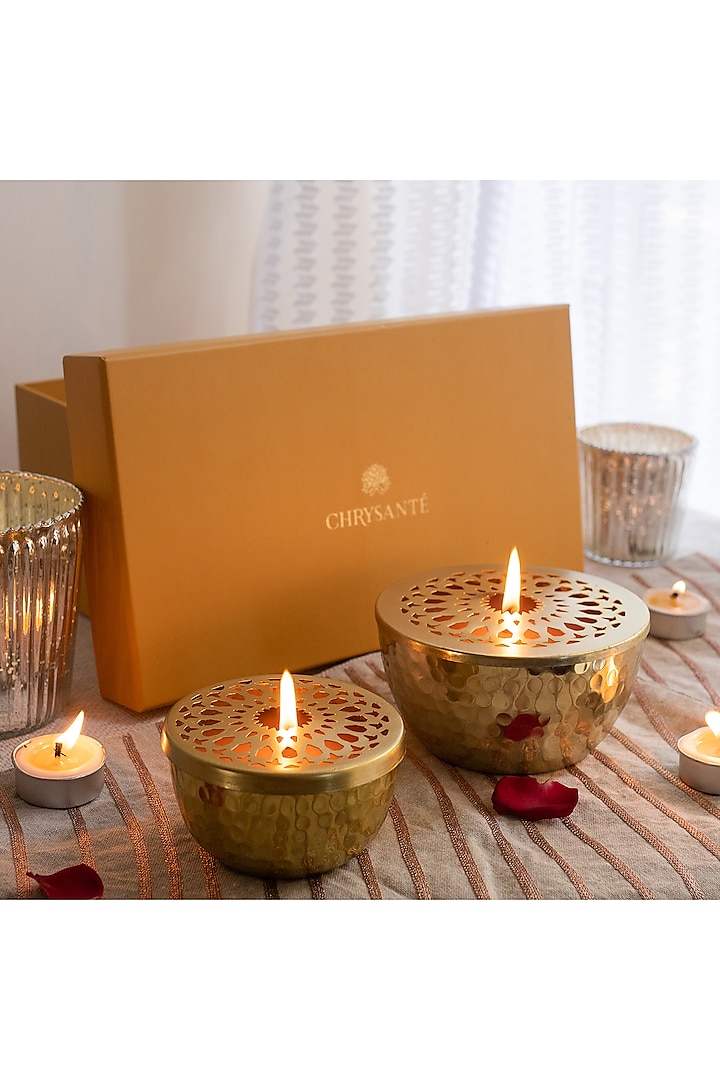 Gold Metal Candles With Jasmine Scented Wax (Set of 2) by Chrysante By Gunjan Gupta