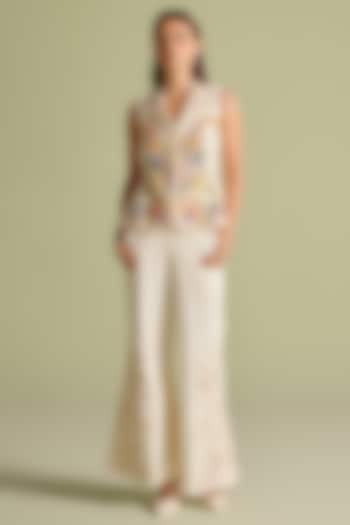 Ivory Cotton Twill Cutwork Flared Pants by Chandrima at Pernia's Pop Up Shop