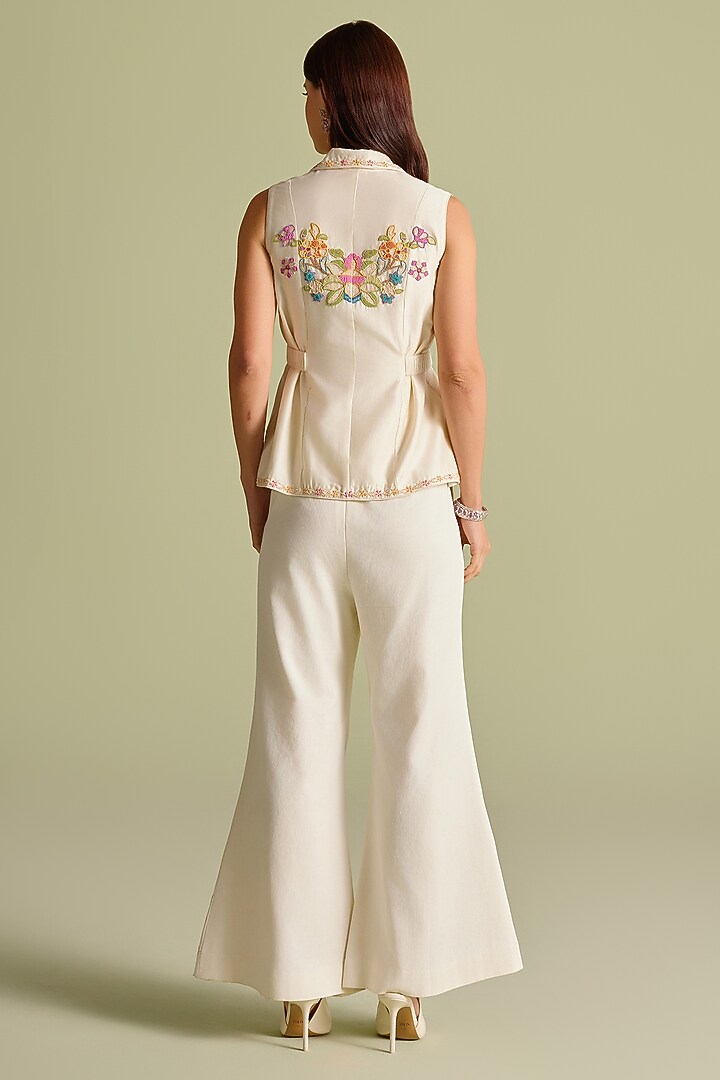 Ivory Cotton Twill Cutwork Flared Pants by Chandrima at Pernia's Pop Up Shop