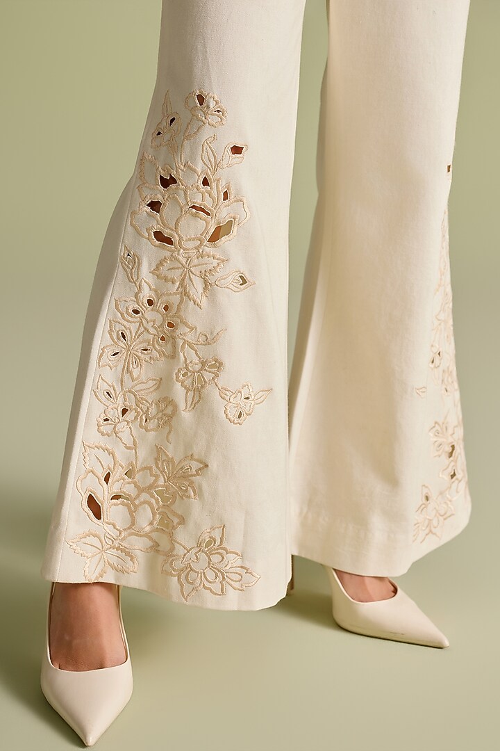 Ivory Cotton Twill Cutwork Flared Pants by Chandrima at Pernia's Pop Up Shop