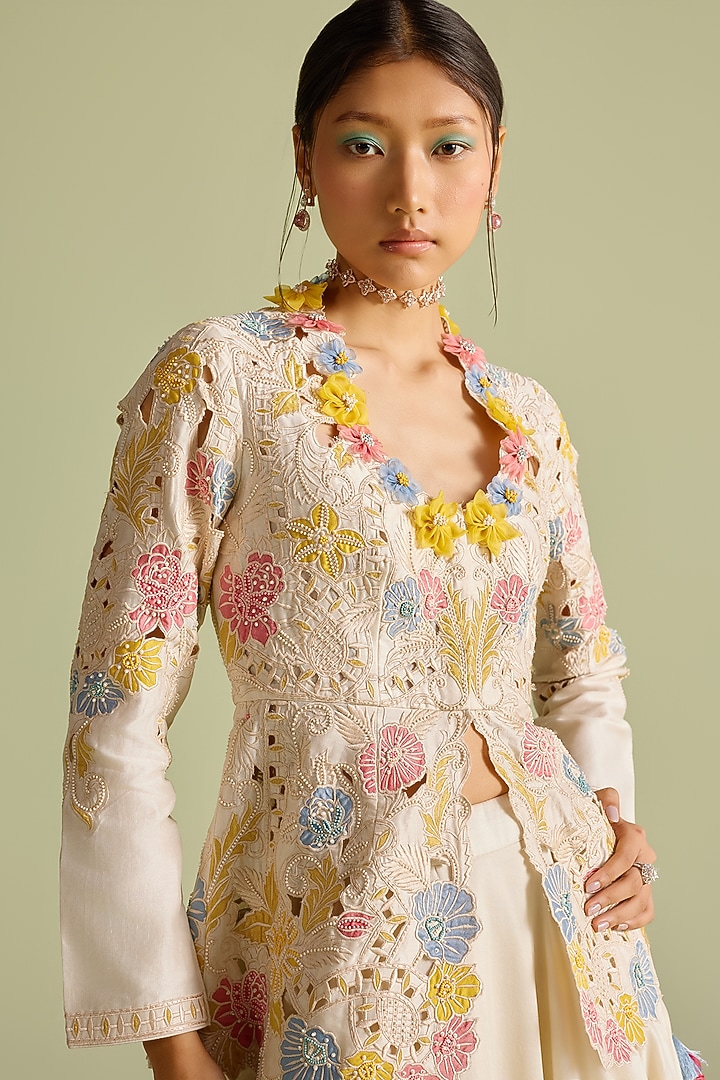 Ivory Chanderi Applique & Cutwork Peplum Jacket by Chandrima at Pernia's Pop Up Shop