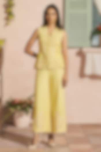 Butter Yellow Cotton Twill Cutwork Flared Pants by Chandrima at Pernia's Pop Up Shop