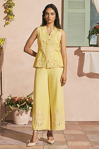 Butter Yellow Cotton Twill Cutwork Flared Pants by Chandrima