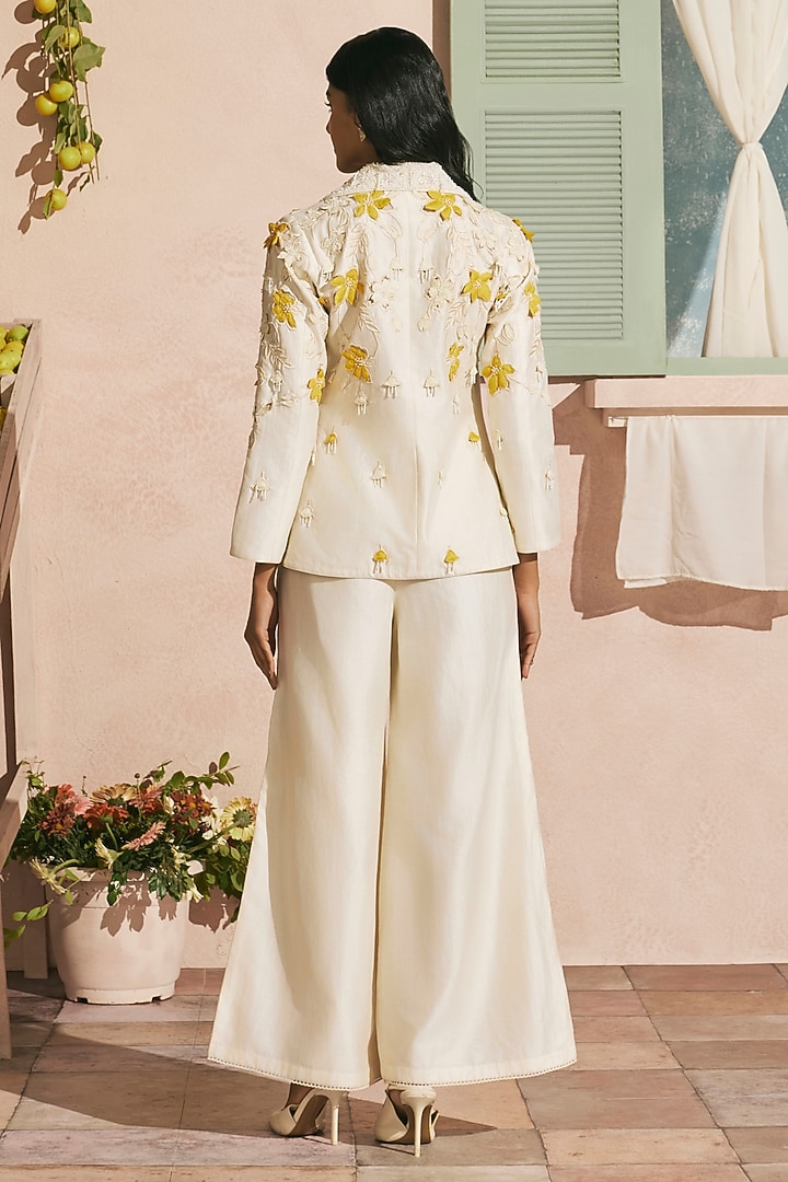 Ivory Chanderi Cutwork Flared Pants by Chandrima at Pernia's Pop Up Shop