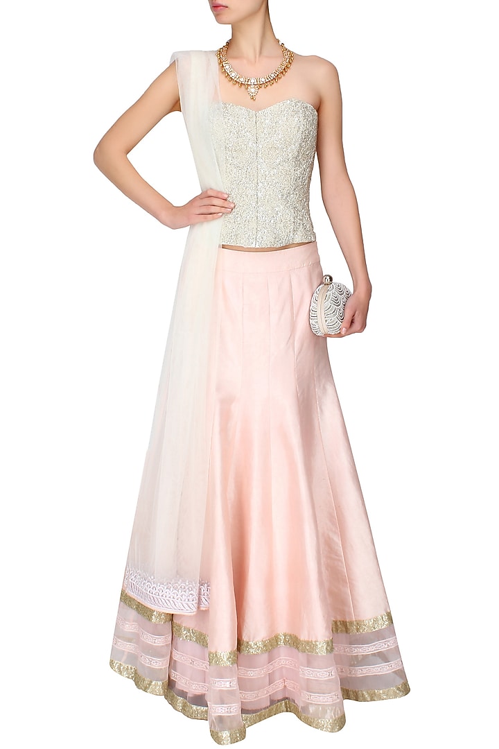 Powder pink sequins embroidered lehenga and ivory beaded corset set available only at Pernia's Pop Up Shop.
