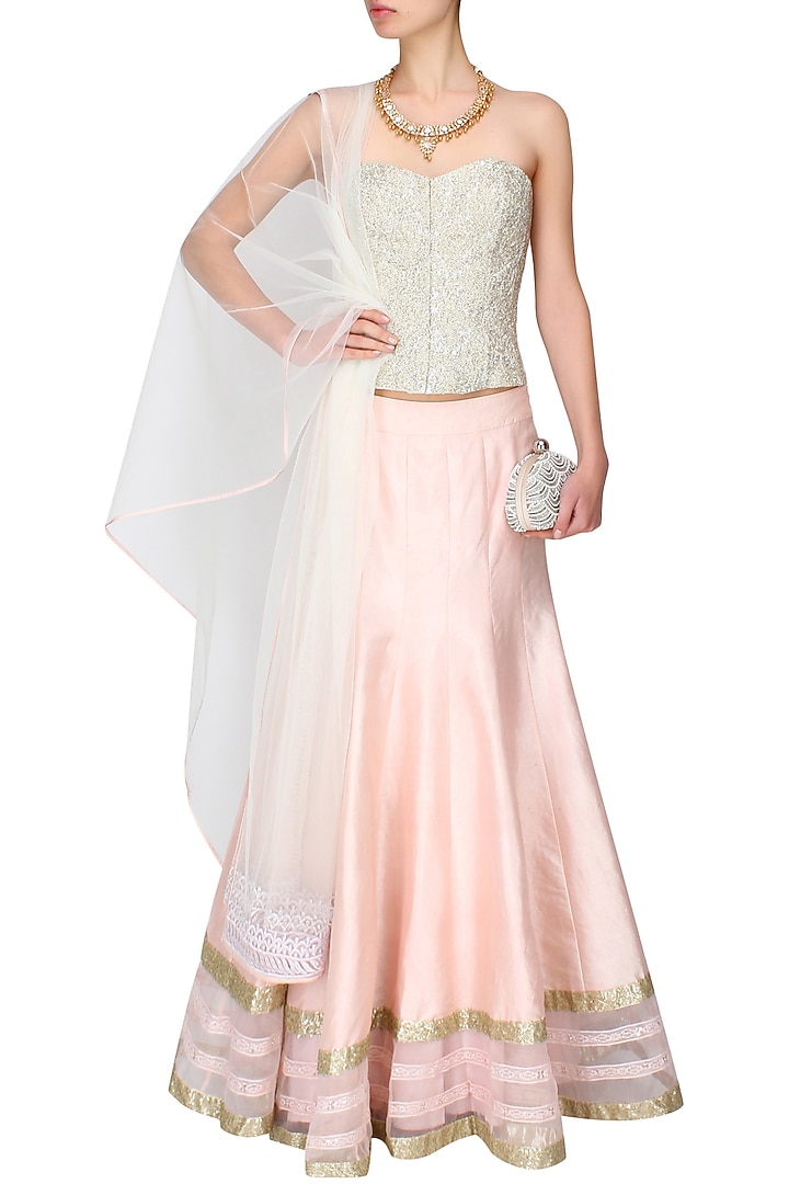 Powder pink sequins embroidered lehenga and ivory beaded corset set available only at Pernia's Pop Up Shop.