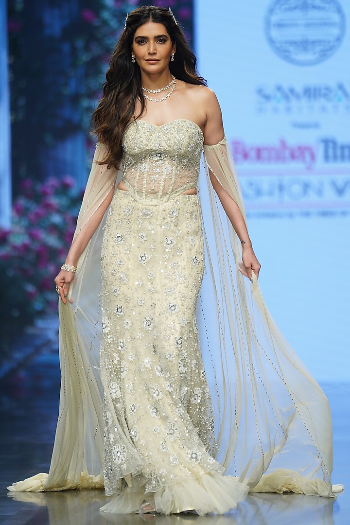 Ivory Net Hand Embroidered Bridal Lehenga Set by Chhavvi Aggarwal at Pernia's Pop Up Shop