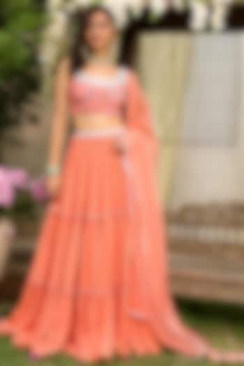 Coral Embroidered Tiered Lehenga Set by Chhavvi Aggarwal