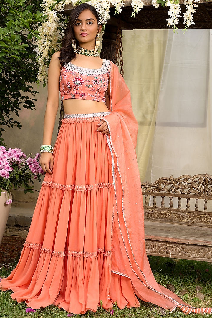 Coral Embroidered Tiered Lehenga Set by Chhavvi Aggarwal