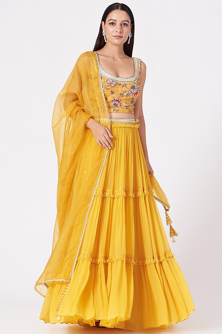 Yellow Georgette Tiered Lehenga Set by Chhavvi Aggarwal