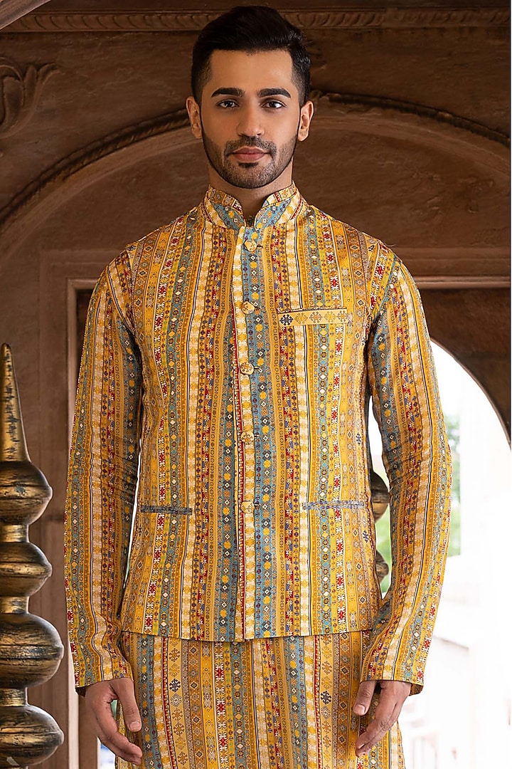 Yellow Printed Bundi Jacket by Chhavvi Aggarwal Men